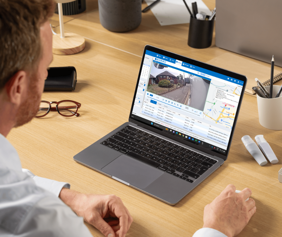 Man going through driving logs of fleet tracking.